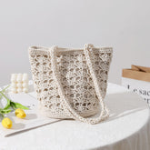 Sac à bandoulière en paille tissé à la main en fil de coton découpé et creux coréen élégant sac à bandoulière en paille portable sac de plage de vacances en bord de mer